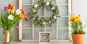 Springtime wreath with tulip bouquets on mantel